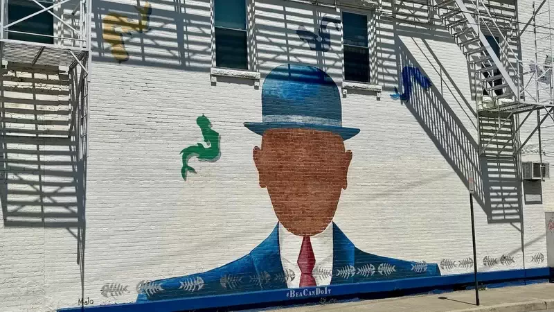  A Magritte-style mural adorns this N. Chestnut Street building. 