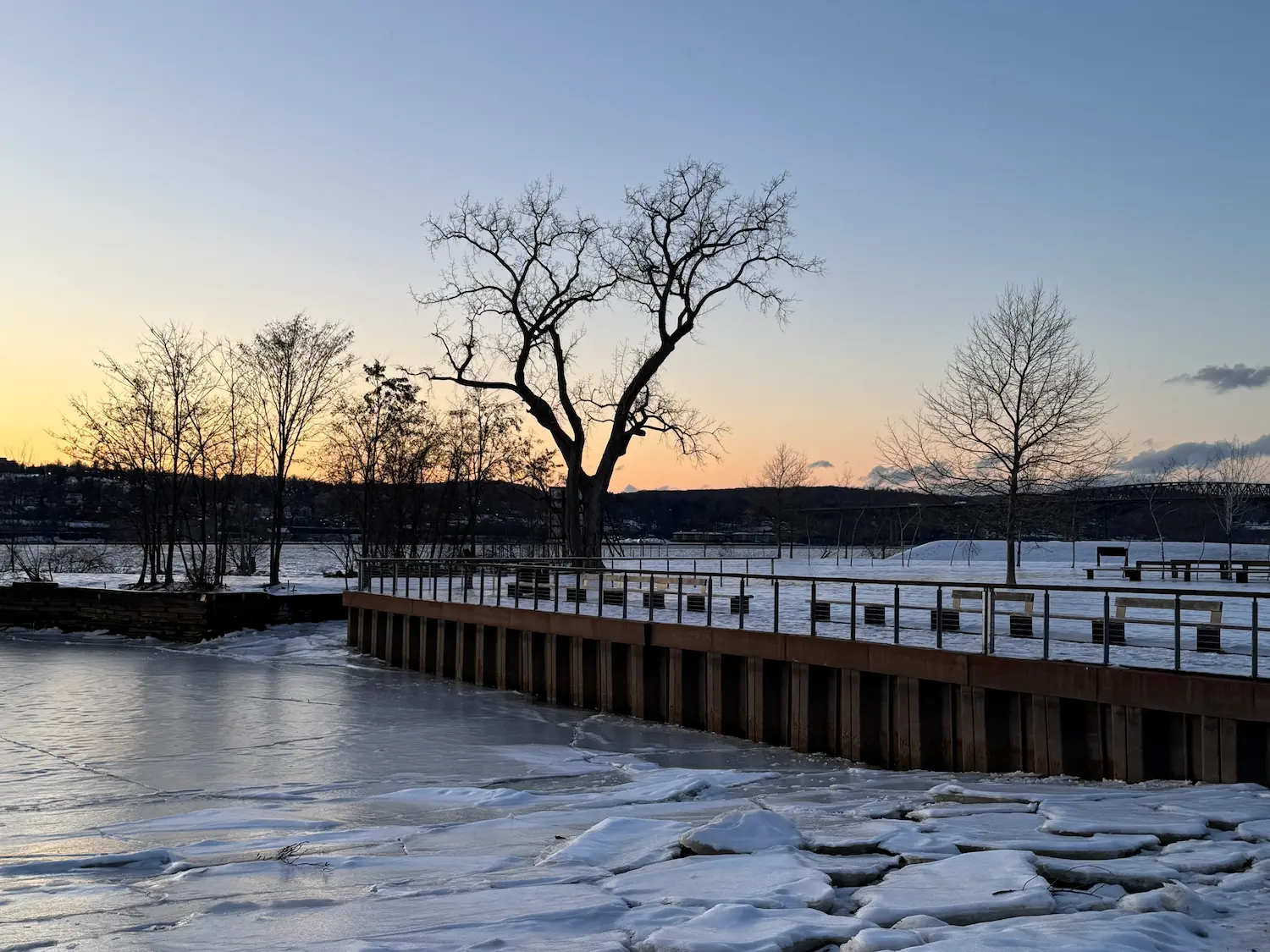 Hudson River frozen over with blocks of ice and snow on Beacon's waterfront